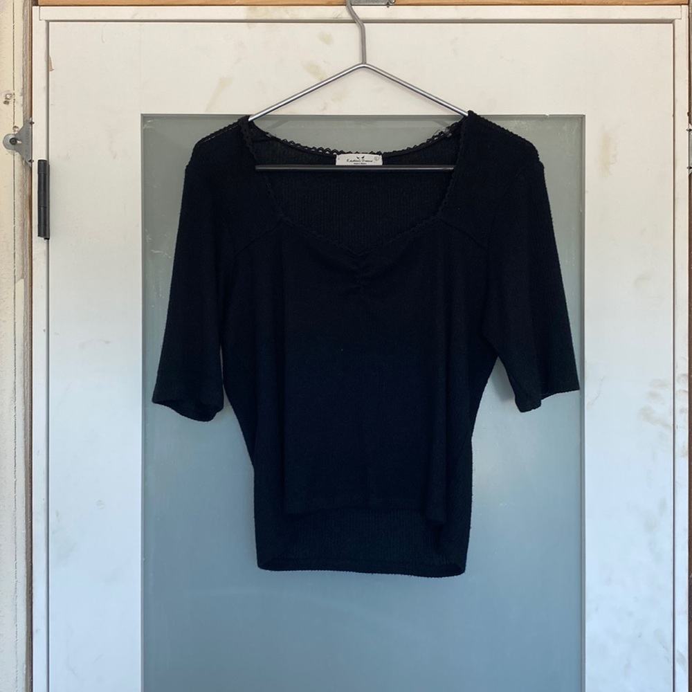black with a sorta black lacey trim and a square neck
